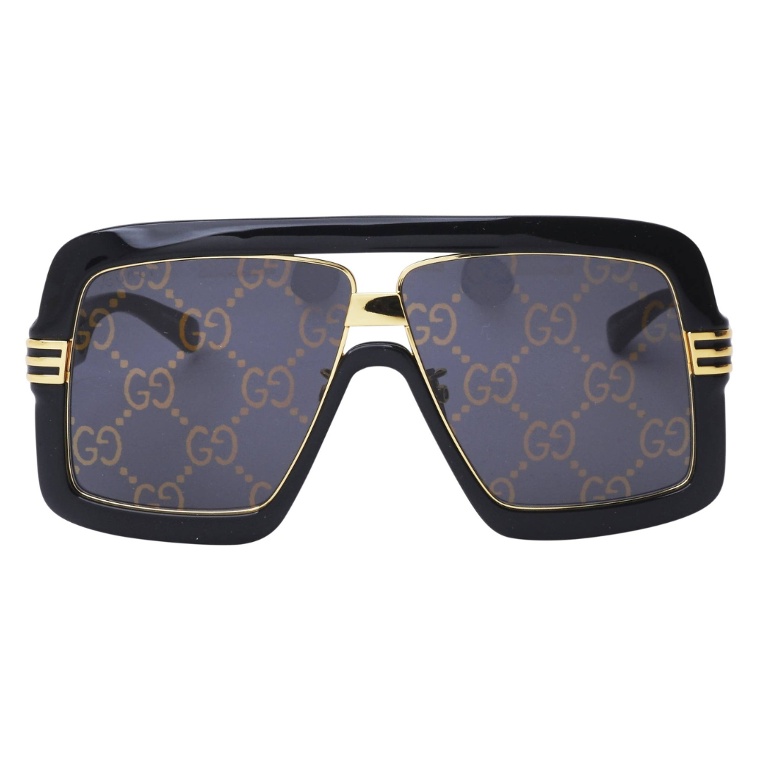 Gucci Sunglasses with black frame, gold accents, and patterned lenses on a white background