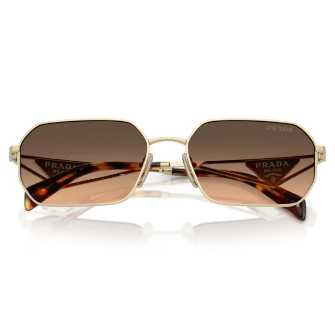 Prada sunglasses with an octagonal gold-tone metal frame, brown gradient lenses, and tortoiseshell temple tips, shown on a white background with a soft reflection.
