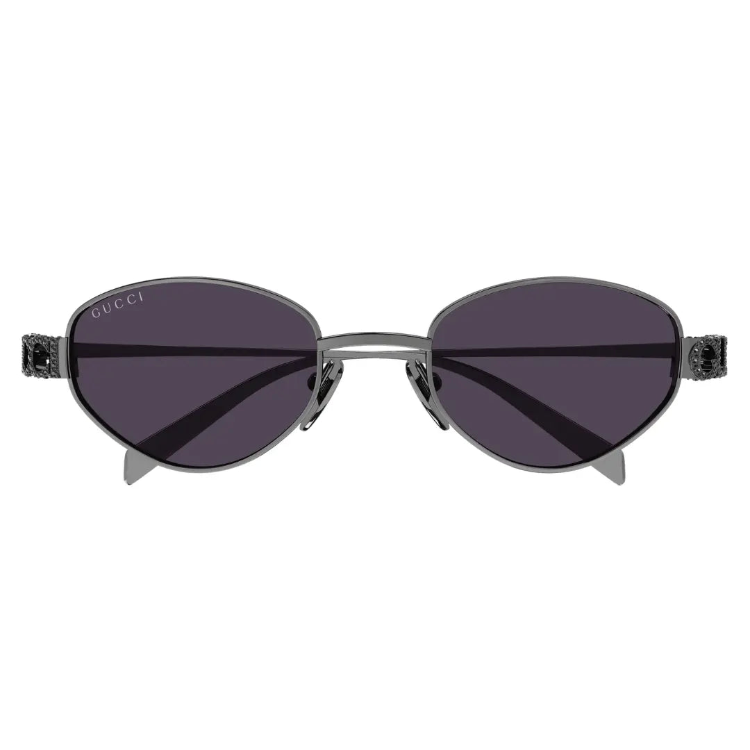 Gucci oval sunglasses with dark gray frames, dark gray lenses, and crystal-accented temples on a white background.